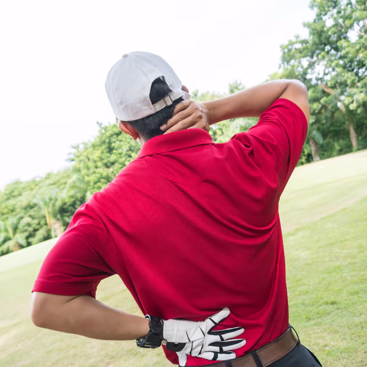 Golfer holding his neck and upper back