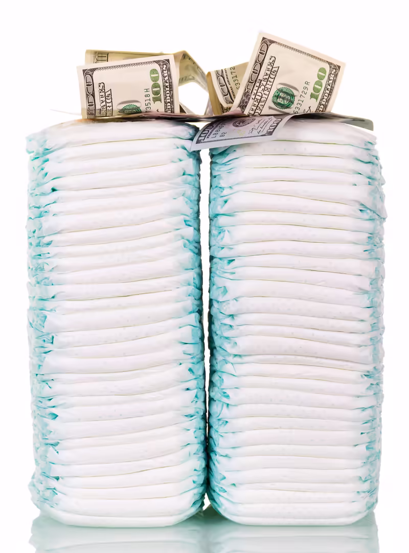 Stack of adult incontinence pads next to cash