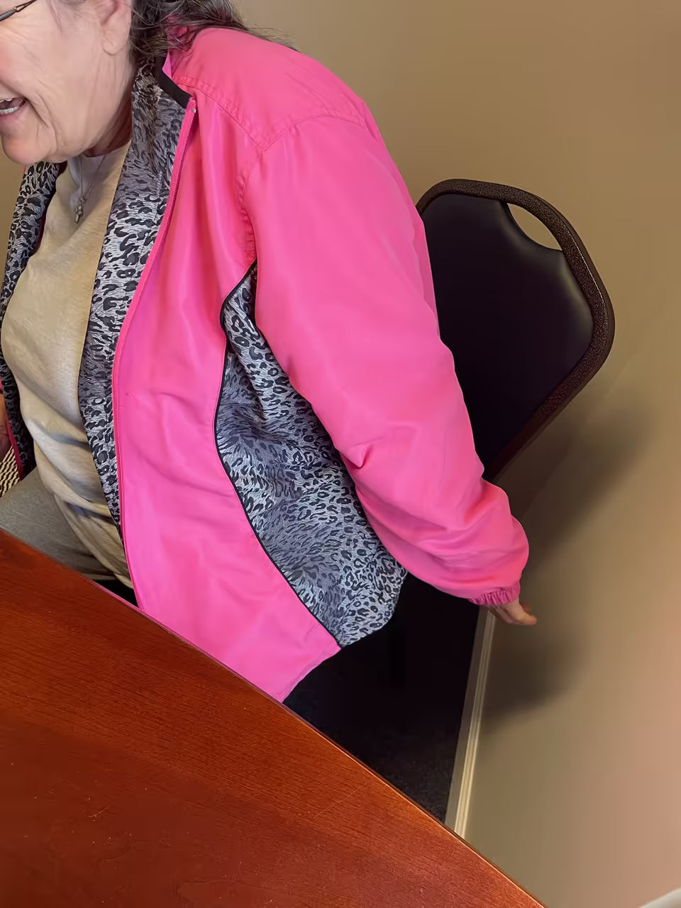 Patient with frozen shoulder showing her range of motion before treatment
