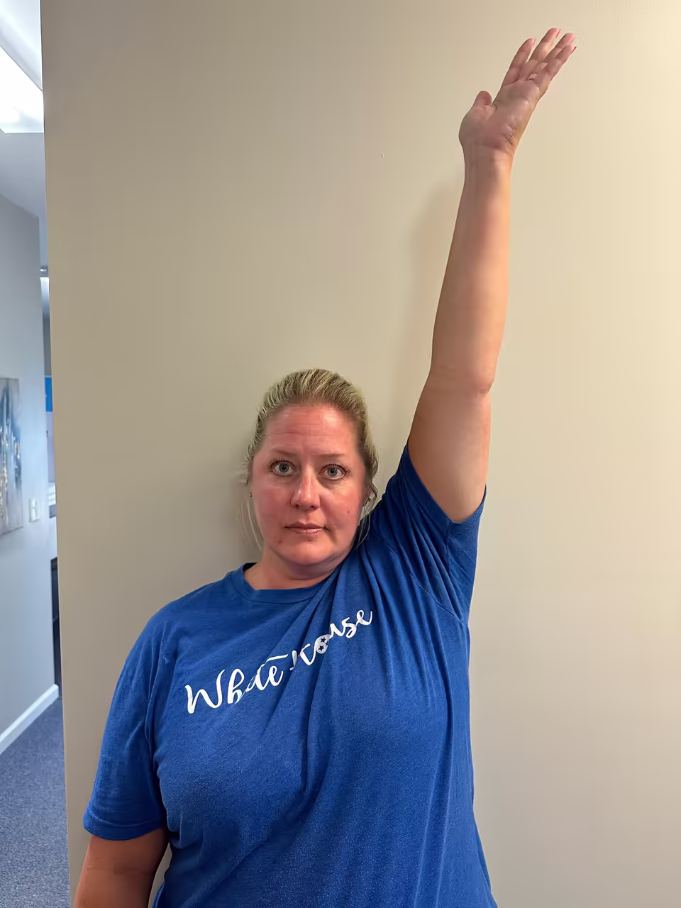Patient raising both arms fully overhead after five treatments
