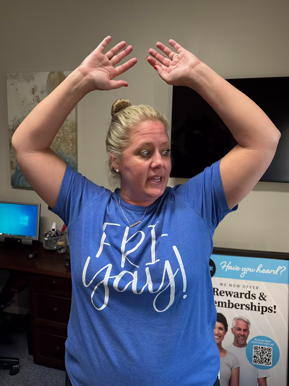 Patient raising her arms partway before treatment